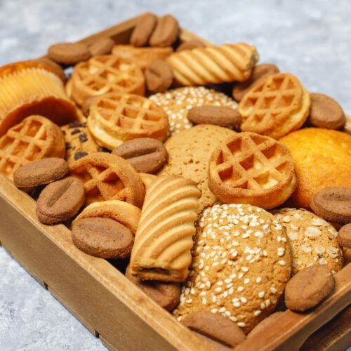 various cookies in wooden tray